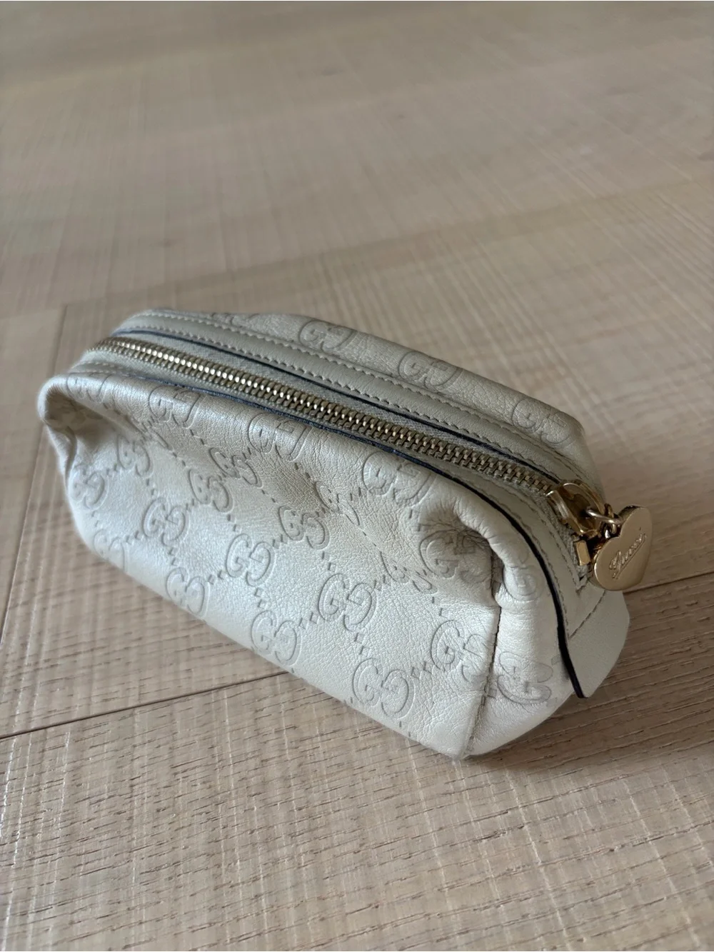 Gucci Guccissima Ivory Leather Zip Cosmetic Pouch with Heart Charm